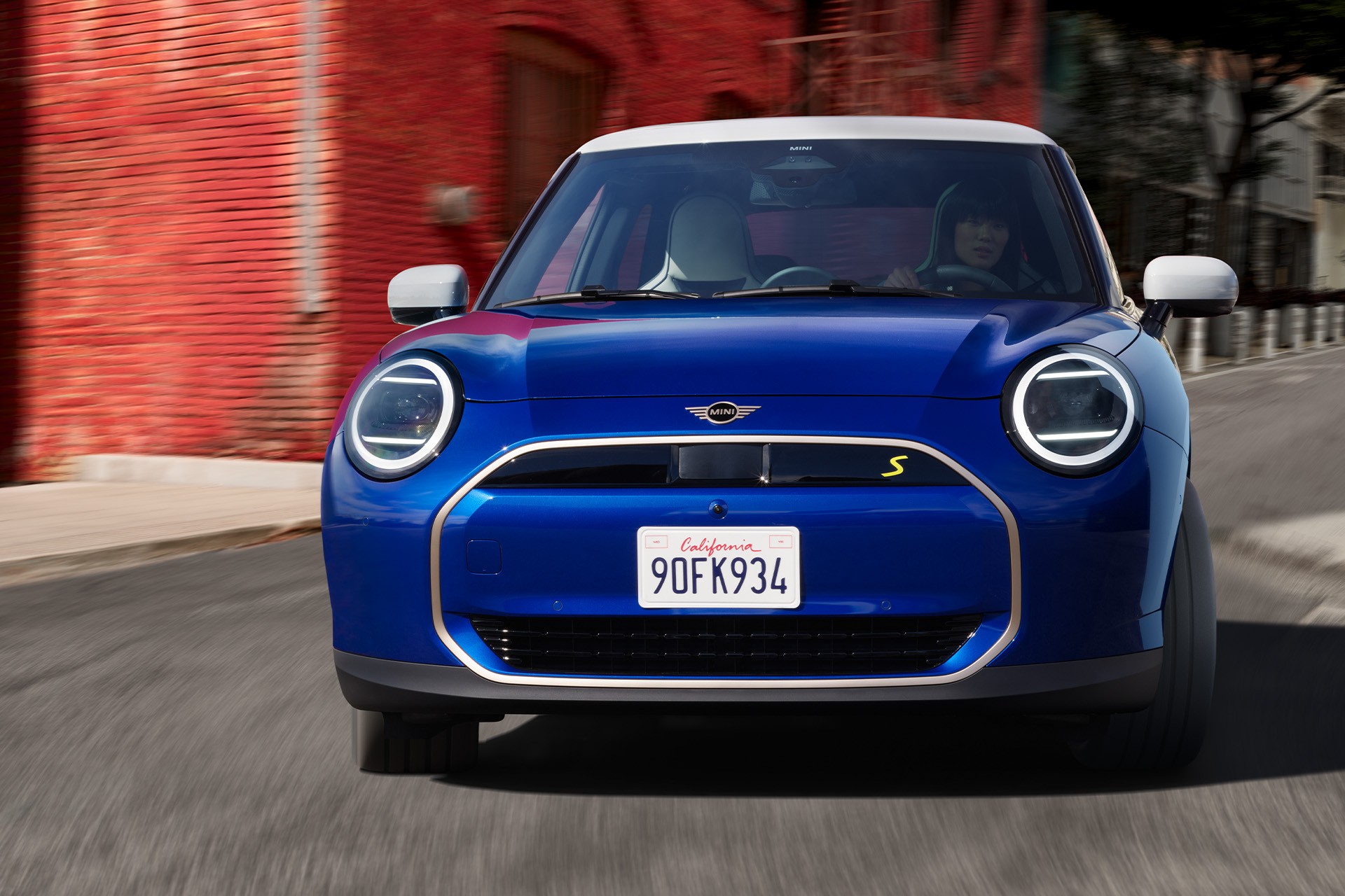 all-electric MINI Cooper driving down the road
